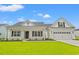 Charming home features a manicured lawn, inviting covered porch and a two-car garage at 5004 Shore Breeze Dr., Myrtle Beach, SC 29588