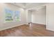 Inviting living area with hardwood floors and large window that offers lots of natural light at 5004 Shore Breeze Dr., Myrtle Beach, SC 29588