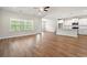 Open-concept living space with wood flooring and an eat-in kitchen with bright natural light at 5004 Shore Breeze Dr., Myrtle Beach, SC 29588