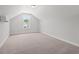 Spacious bedroom with neutral carpet, a window offering natural light, and a blank canvas for personalization at 5009 Shore Breeze Dr., Myrtle Beach, SC 29588