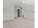 Large, carpeted bedroom with view into closet and bath with an installed mini-split air conditioner at 5009 Shore Breeze Dr., Myrtle Beach, SC 29588
