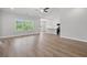 Open-concept living area showcasing wood-look floors and views of the bright kitchen and outdoor scenery at 5009 Shore Breeze Dr., Myrtle Beach, SC 29588