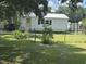 The house's backyard with yellow accents and fence at 518 Nowell St., Georgetown, SC 29440