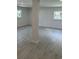 Spacious basement with light vinyl flooring and ample natural light at 518 Nowell St., Georgetown, SC 29440