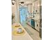 Charming kitchen with stainless steel appliances, white cabinets, and adjacent seating area at 518 Nowell St., Georgetown, SC 29440