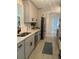Updated kitchen with modern appliances, gray cabinets, and quartz countertops at 518 Nowell St., Georgetown, SC 29440
