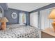Cozy bedroom with two beds, soft blue walls, and ample closet space at 5515 N Ocean Blvd. # 209, Myrtle Beach, SC 29577