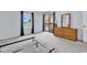 Bedroom with balcony, neutral carpet, light blue walls, and wood furniture at 5515 N Ocean Blvd. # 209, Myrtle Beach, SC 29577