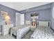 Charming bedroom with twin beds, soft lighting, and a relaxed ambiance at 5515 N Ocean Blvd. # 209, Myrtle Beach, SC 29577
