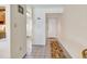 Hallway leading to the front door and kitchen, tiled floors provide easy maintenance at 5515 N Ocean Blvd. # 209, Myrtle Beach, SC 29577
