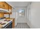 Bright kitchen features wood cabinets, white appliances, and a window providing natural light at 5515 N Ocean Blvd. # 209, Myrtle Beach, SC 29577