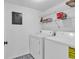 Laundry room with tile floors and washer and dryer at 5515 N Ocean Blvd. # 209, Myrtle Beach, SC 29577