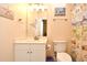 Cozy bathroom with a beachy theme, white vanity, and decorative shower curtain at 5825 Catalina Dr. # 833, North Myrtle Beach, SC 29582