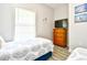 Cozy bedroom with two twin beds, accent pillows, dresser, and wall art for a welcoming space at 5825 Catalina Dr. # 833, North Myrtle Beach, SC 29582