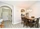 Dining room with white trim, wood table, seating for six, and opening to kitchen and hallway at 5825 Catalina Dr. # 833, North Myrtle Beach, SC 29582