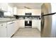 Bright kitchen with stainless appliances, white cabinets, and stylish backsplash at 5825 Catalina Dr. # 833, North Myrtle Beach, SC 29582