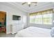 Spacious main bedroom with flatscreen tv, dresser and large window for natural lighting at 5825 Catalina Dr. # 833, North Myrtle Beach, SC 29582