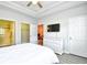 Inviting bedroom featuring closet, ensuite bathroom, flatscreen television and neutral decor at 5825 Catalina Dr. # 833, North Myrtle Beach, SC 29582