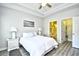 Comfortable main bedroom with tray ceiling, fan, nightstands, and ensuite bathroom at 5825 Catalina Dr. # 833, North Myrtle Beach, SC 29582