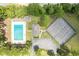 Aerial view of the community pool, clubhouse, tennis courts and ample parking at 589 Boundaryline Dr. Nw, Calabash, NC 28467