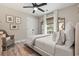 Inviting bedroom featuring a plush bed, natural light, and cozy wicker chair at 589 Boundaryline Dr. Nw, Calabash, NC 28467