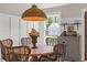 Charming dining nook with natural light, decor, and view to the property's exterior at 589 Boundaryline Dr. Nw, Calabash, NC 28467