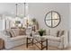 Spacious living room with hardwood floors and an open layout leading into a kitchen at 589 Boundaryline Dr. Nw, Calabash, NC 28467