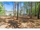 Large lot with mature trees, a house, and shed providing ample space for outdoor enjoyment at 589 Boundaryline Dr. Nw, Calabash, NC 28467