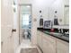 Cozy bathroom featuring white cabinets, granite counters, and a shower/tub combo at 59 Bay Tree Ln., Pawleys Island, SC 29585