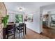 Dining room and kitchen area featuring hardwood floors and neutral colors at 59 Bay Tree Ln., Pawleys Island, SC 29585