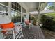 Covered front porch with rocking chairs and a brick floor at 59 Bay Tree Ln., Pawleys Island, SC 29585
