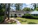 Charming home with a landscaped front yard, inviting walkway, and lovely curb appeal at 59 Bay Tree Ln., Pawleys Island, SC 29585