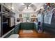 Kitchen with stainless steel appliances, green cabinets and hardwood floors at 59 Bay Tree Ln., Pawleys Island, SC 29585
