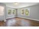 Bedroom with hardwood floors, many windows and light gray walls at 602 3Rd Ave. N, Myrtle Beach, SC 29577