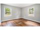 Bedroom with hardwood floors, light walls, and bright windows at 602 3Rd Ave. N, Myrtle Beach, SC 29577