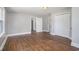 Spacious bedroom features hardwood floors, light walls, and multiple closet doors at 602 3Rd Ave. N, Myrtle Beach, SC 29577