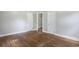 Bedroom with hardwood floors, bright walls, and open closets for ample storage at 602 3Rd Ave. N, Myrtle Beach, SC 29577