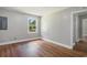 Bedroom featuring hardwood floors, a bright window, and light walls at 602 3Rd Ave. N, Myrtle Beach, SC 29577