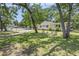 Charming home featuring a lush green lawn and mature trees, perfect for outdoor relaxation at 602 3Rd Ave. N, Myrtle Beach, SC 29577