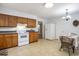 Well-lit kitchen with tile floors, wooden cabinets and eat in table at 602 3Rd Ave. N, Myrtle Beach, SC 29577
