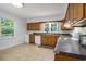 Efficient kitchen with wooden cabinets, tile floor and plenty of natural light at 602 3Rd Ave. N, Myrtle Beach, SC 29577