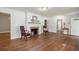 Bright living room with fireplace, hardwood floors, and views into other rooms at 602 3Rd Ave. N, Myrtle Beach, SC 29577