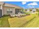 Outdoor patio featuring a screened-in porch with a seating area and landscaping at 6029 Campanella St., Myrtle Beach, SC 29572