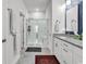 Modern bathroom featuring a glass walk-in shower, white cabinets, and marble tile flooring at 6029 Campanella St., Myrtle Beach, SC 29572