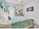 Bedroom with patterned bedding, side tables and lamps. Features neutral tones and modern decor at 6029 Campanella St., Myrtle Beach, SC 29572