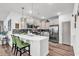 Modern kitchen features white cabinets, quartz countertops, an island with seating and stainless steel appliances at 6029 Campanella St., Myrtle Beach, SC 29572