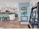 Stylish kitchen features an island with seating and stainless steel appliances plus wood flooring at 6029 Campanella St., Myrtle Beach, SC 29572