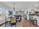 Open-concept living space with a dining area, ample natural light, and modern furnishings at 6029 Campanella St., Myrtle Beach, SC 29572