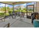 Inviting screened porch with outdoor seating area and neighborhood views at 6029 Campanella St., Myrtle Beach, SC 29572