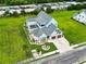 Aerial view of the home with a pool, backyard, and a three-car garage with a driveway at 607 Boone Hall Dr., Myrtle Beach, SC 29579
